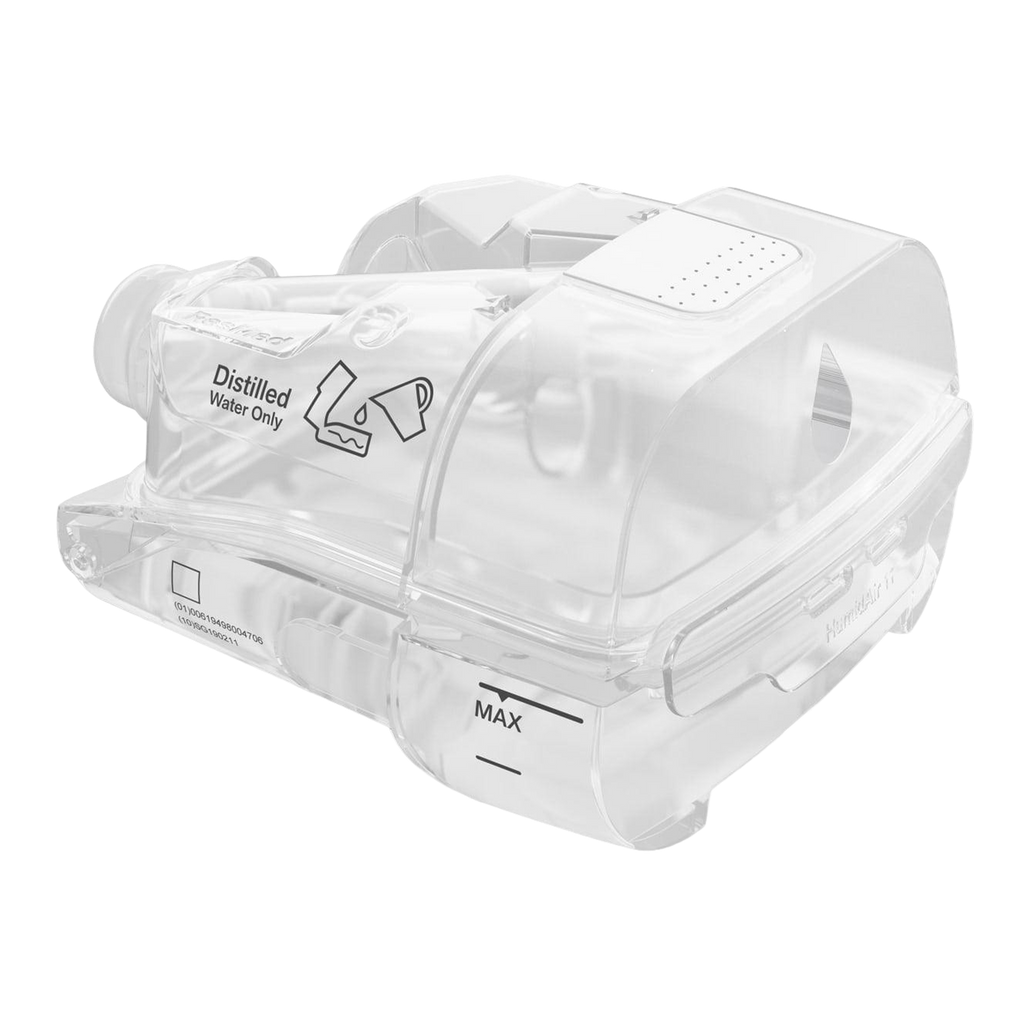 ResMed AirSense 11 humidifier chamber, a transparent water reservoir with a max fill line, labeled for use with distilled water only.