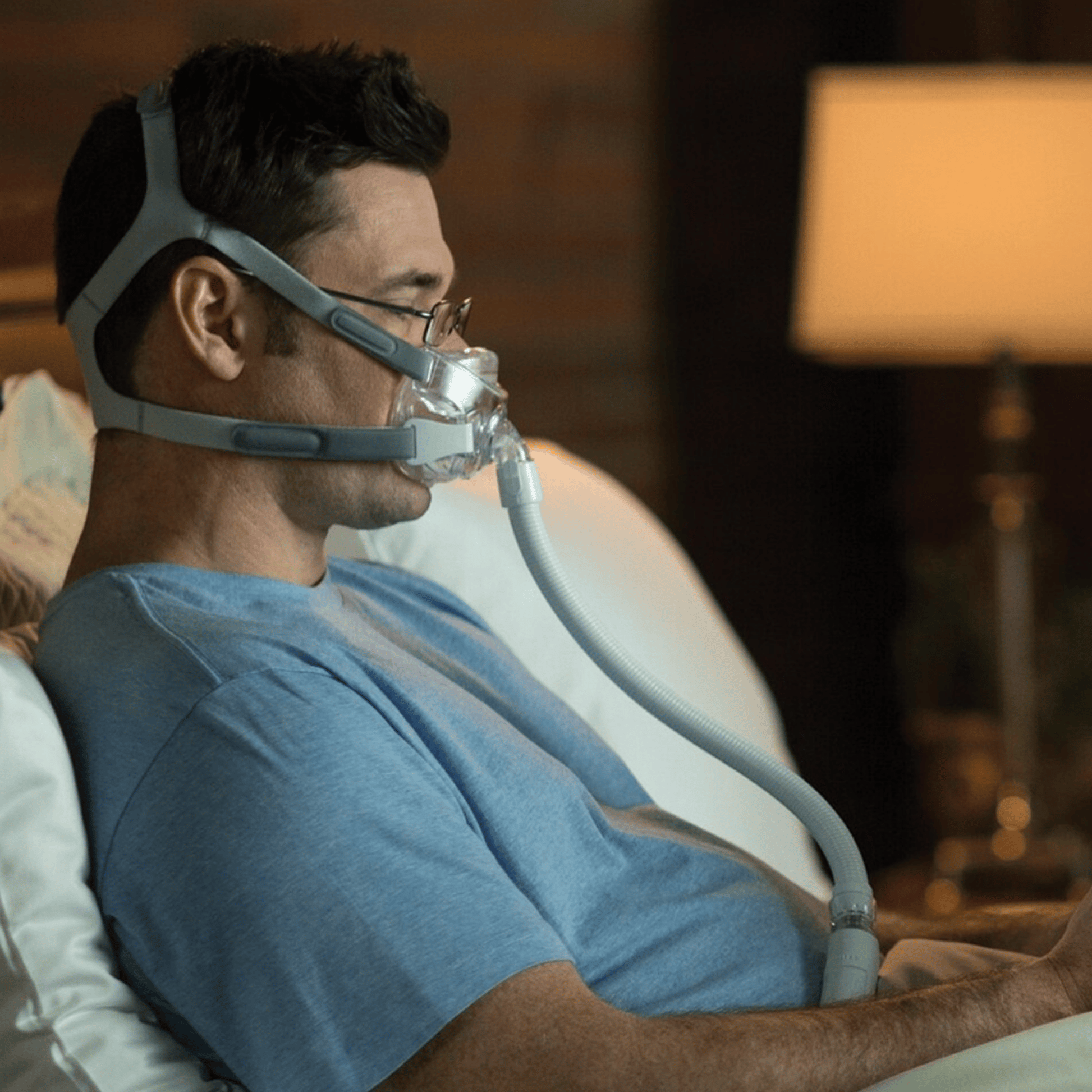 man wearing amara view mask in bed seen from the side